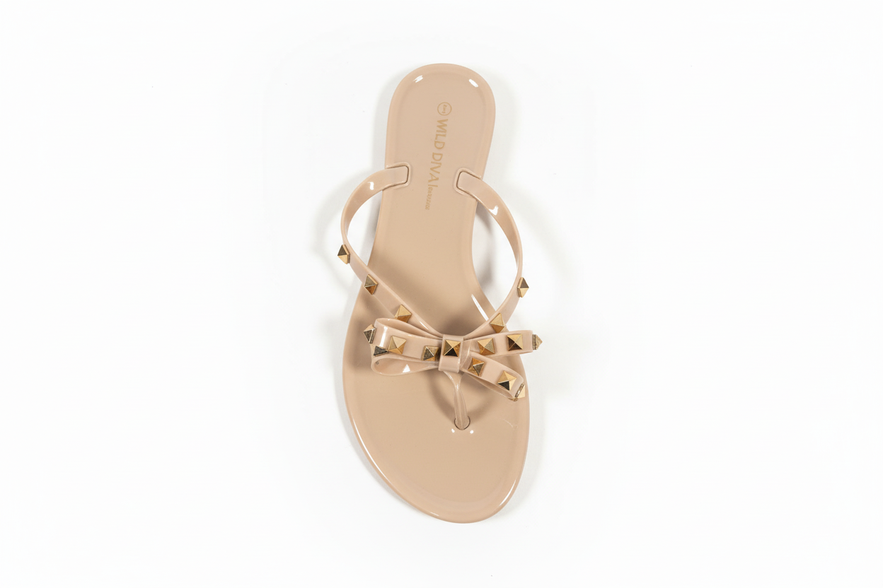 Wild Diva studded jelly sandals top view showing insole - nude beige flat sandals with gold bow detail