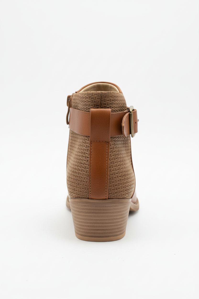 Tan ankle bootie back view showing laser-cut perforated pattern