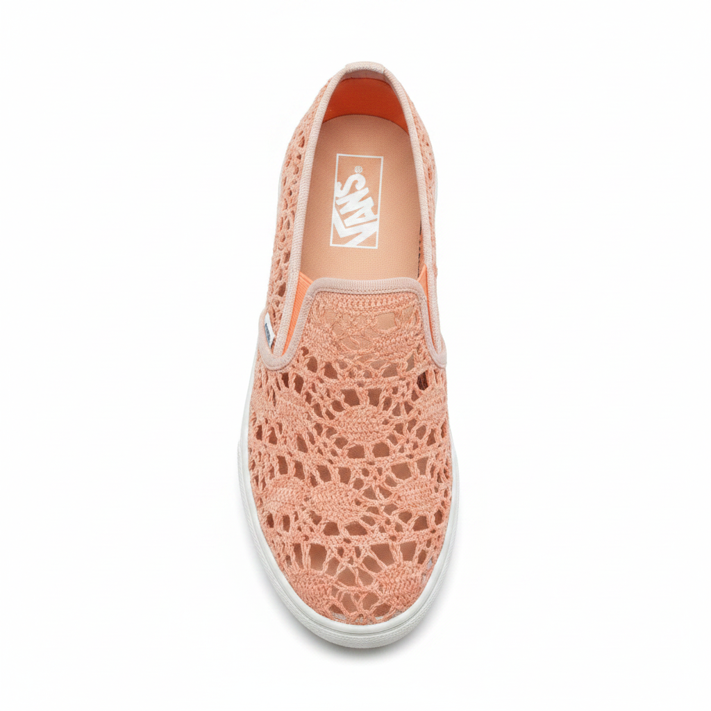 Women's peach open-lace crochet sneaker top-down view showing intricate mesh pattern and toe box, white background