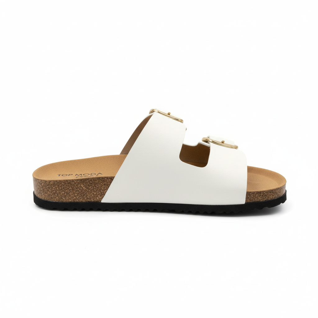 Women's white double-strap slide sandal with oversized gold square buckles and cork footbed, side profile view, white background - BellanBlue