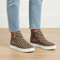 Women's leopard print platform sneaker bootie with dual silver zippers on light wood floor - BellanBlue
