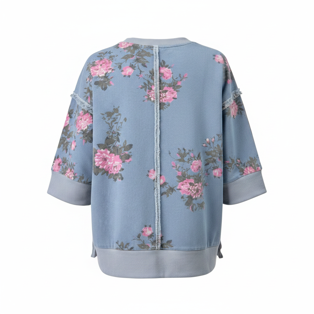 Women's dusty blue floral top back view, ghost mannequin, pink peony print, exposed raw seam, ribbed hem band