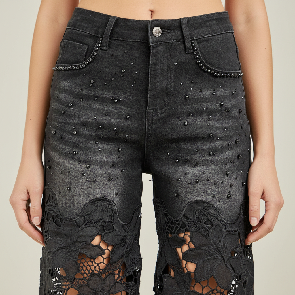 Close-up black pearl stud pocket trim and 3D floral lace panel detail on high waist jeans