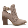 Women's taupe perforated faux suede pointed toe bootie with gold buckle accent and tall stacked wood block heel side profile view white background