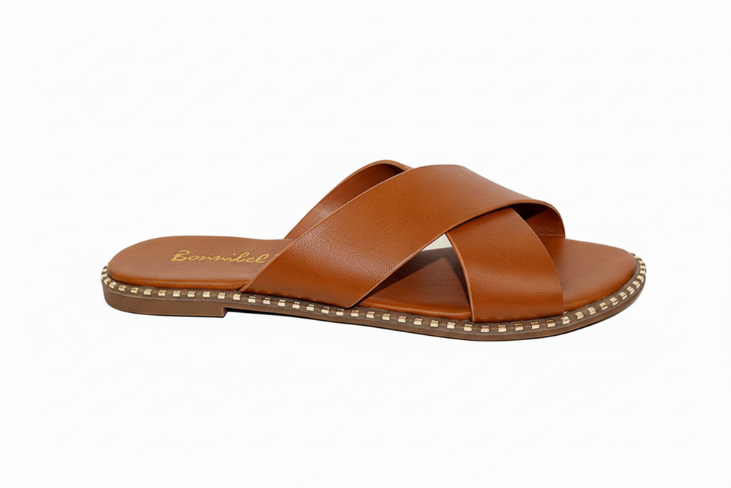 Tan slide sandals with crisscross straps - side profile