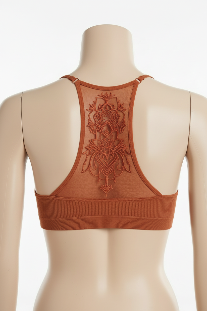 Leto Collection rust racerback bralette back view on mannequin, tattoo mesh mandala panel detail, white background
