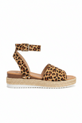 Women's leopard print espadrille platform sandal side view showing ankle strap and jute platform sole