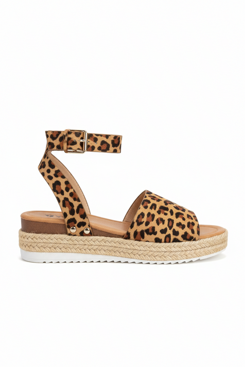 Women's leopard print espadrille platform sandal side view showing ankle strap and jute platform sole