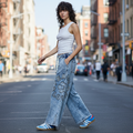 Denim garment styled with model walking on city street - BellanBlue