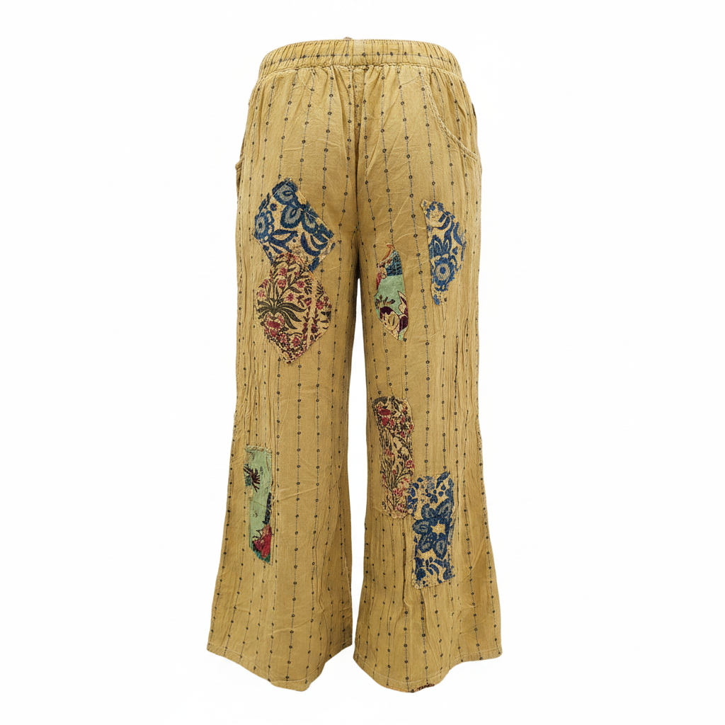 Women's golden mustard wide-leg pant back view, patchwork paisley and lace patches, drawstring elastic waist, crinkled cotton, one-size