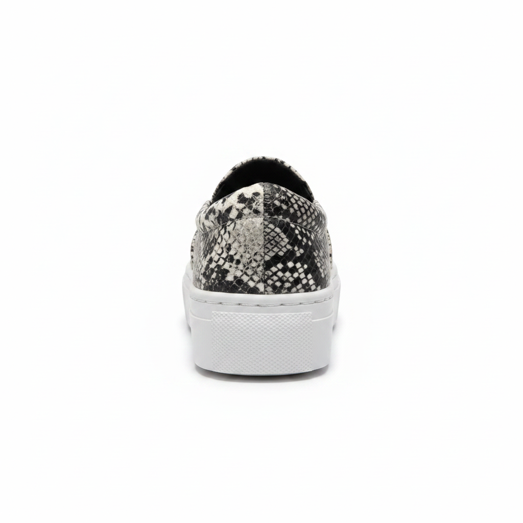 Women's black white snakeskin platform slip-on sneaker back view heel detail white background
