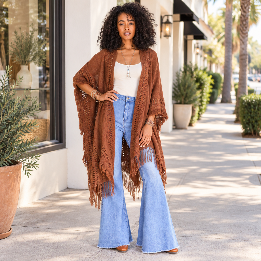 Leto Collection women's brown fringed open-knit ruana styled with jeans outside a boutique - BellanBlue