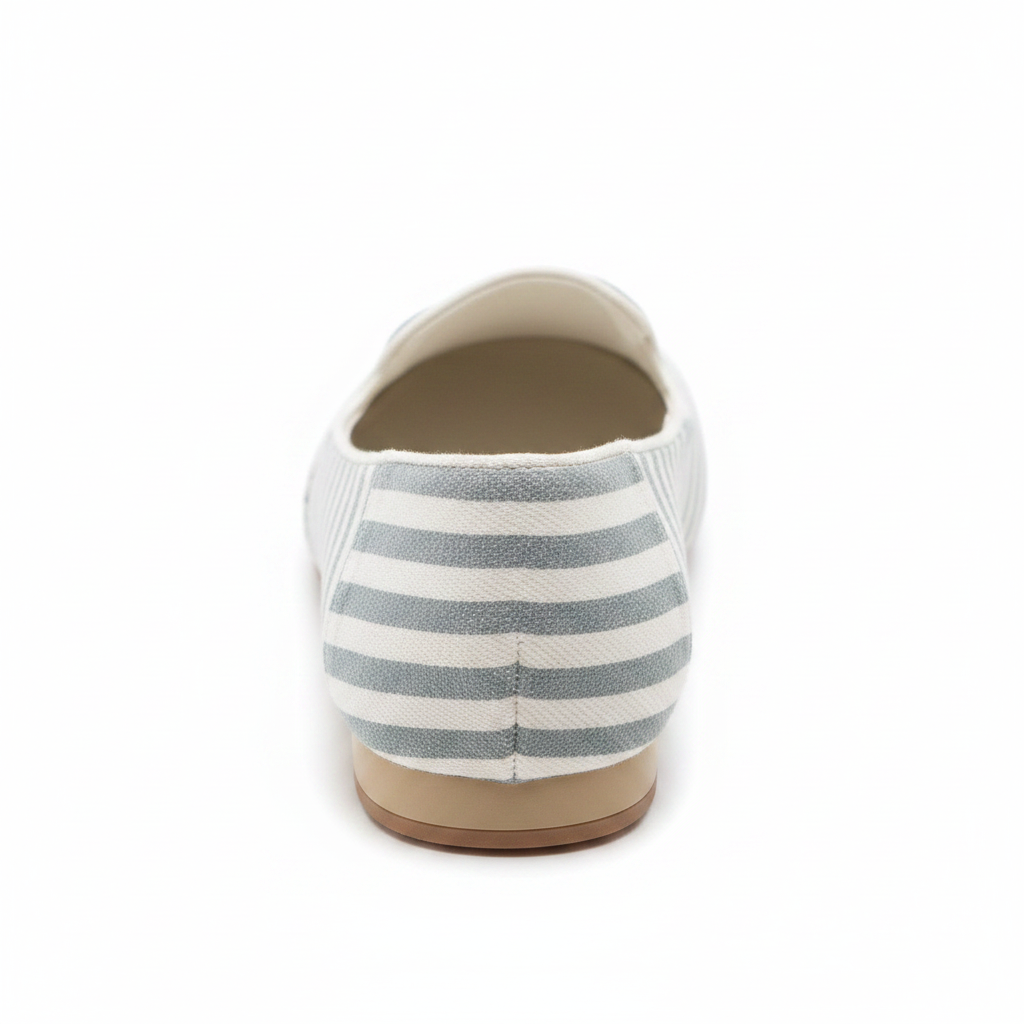 Grey and white stripe slip-on flat, back view showing heel and slip-on opening on white background
