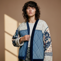 Close-up detail of POL Clothing quilted denim patchwork V-neck cardigan, floral and stripe sleeve panels
