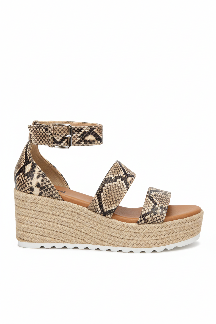 Snake print wedge sandal on a white background