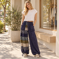 Sage + Fig women's navy floral patchwork wide-leg pants outside a boutique - BellanBlue