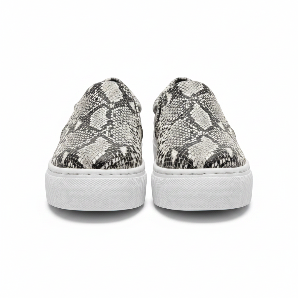 Women's snakeskin platform slip-on sneaker front view symmetrical white studio