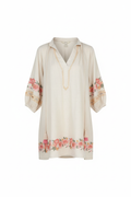 Floral Embroidered Boho Tunic Dress with Puff Sleeves - Front View - Cream beige dress with pink coral floral embroidery and tassel-tie v-neck