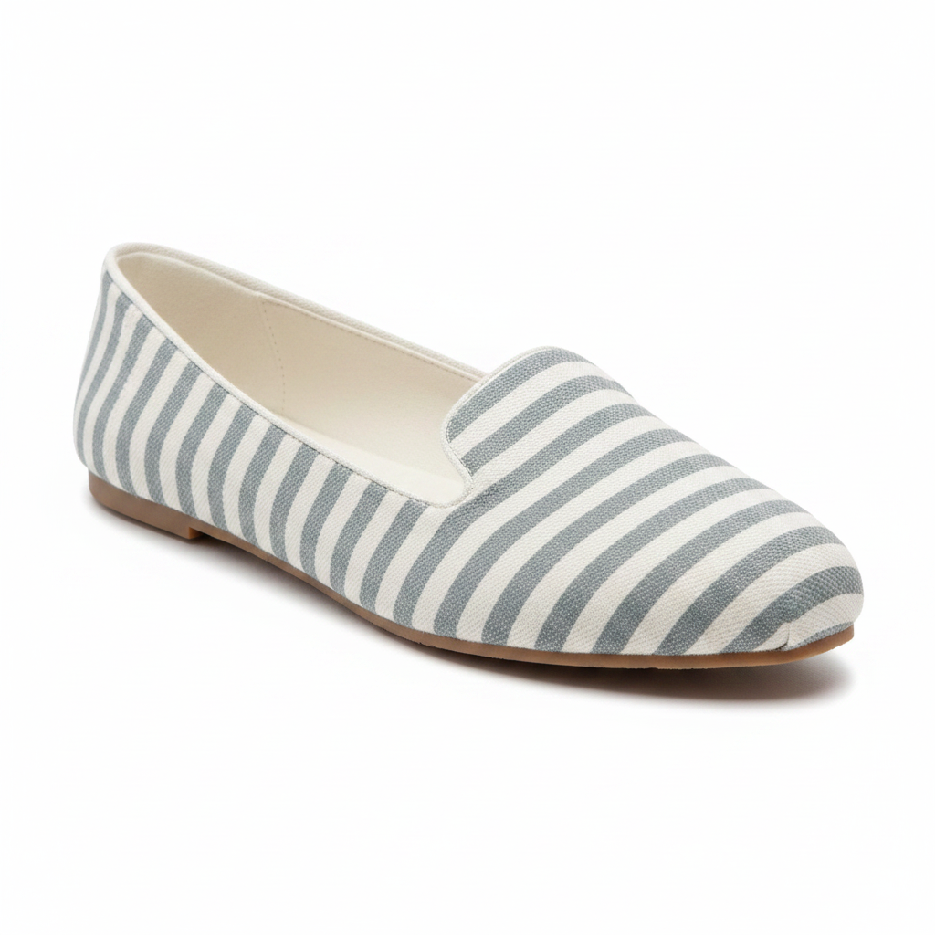 Grey and white stripe slip-on flat, 3/4 angle view showing toe and side profile on white background