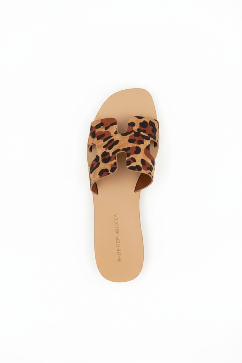 Women's leopard print slide sandal top view showing tan footbed and interior
