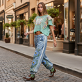 POL women's blue denim floral embroidered jogger pants with white side trim, boutique street style