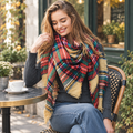 Leto Collection women's plaid blanket scarf styled for an outdoor cafe