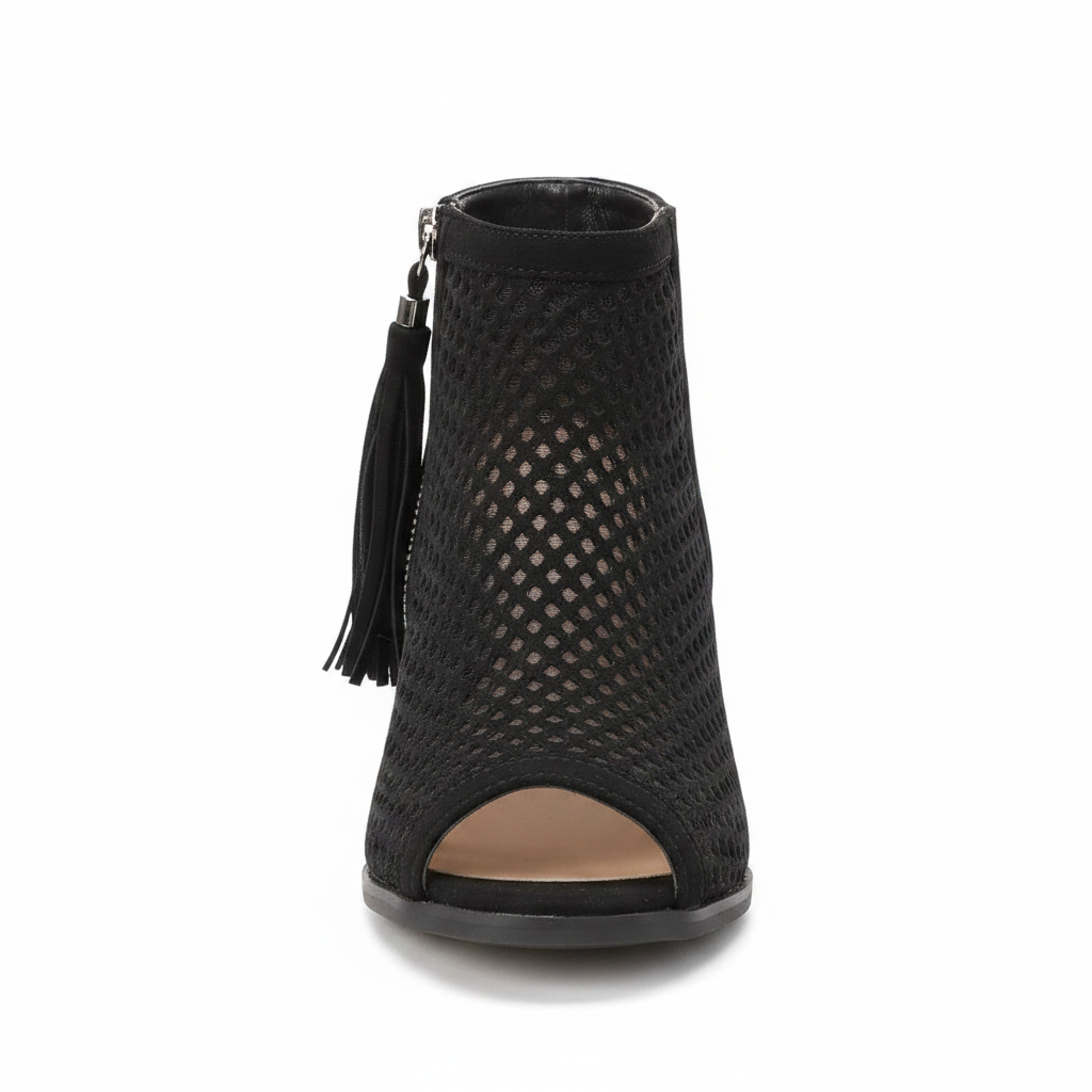 Black perforated peep-toe bootie with fringe tassel zipper and block heel, front view on white background