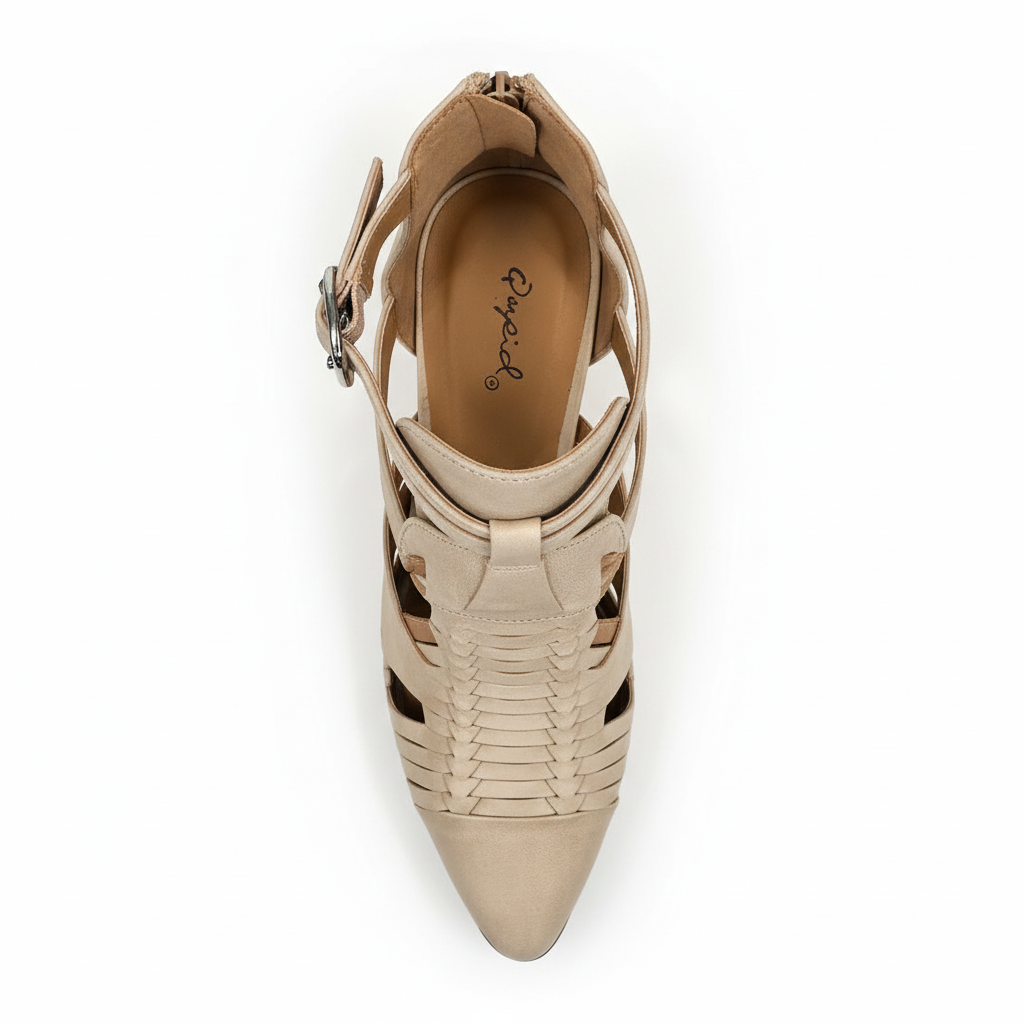 Top view of beige ankle bootie showing interior insole and construction quality