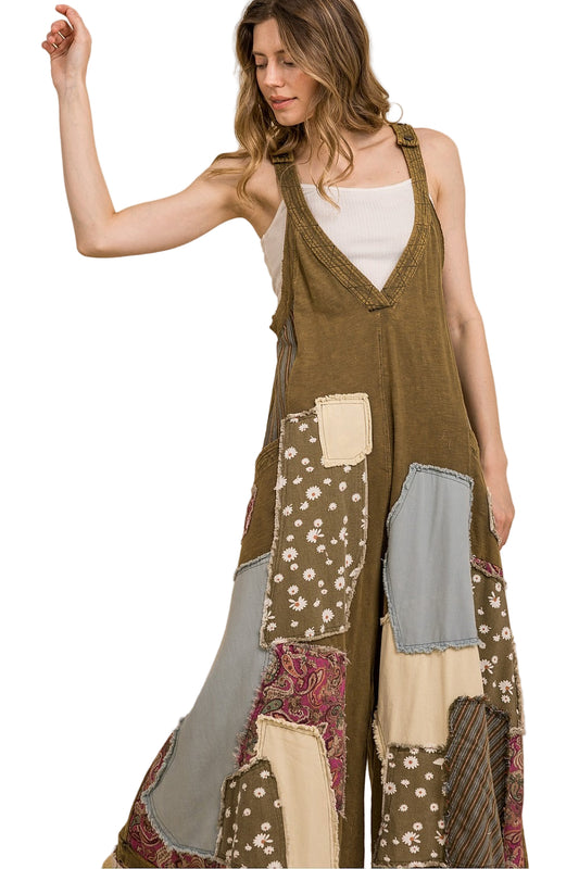 Woman wearing a patchwork dress with a white background