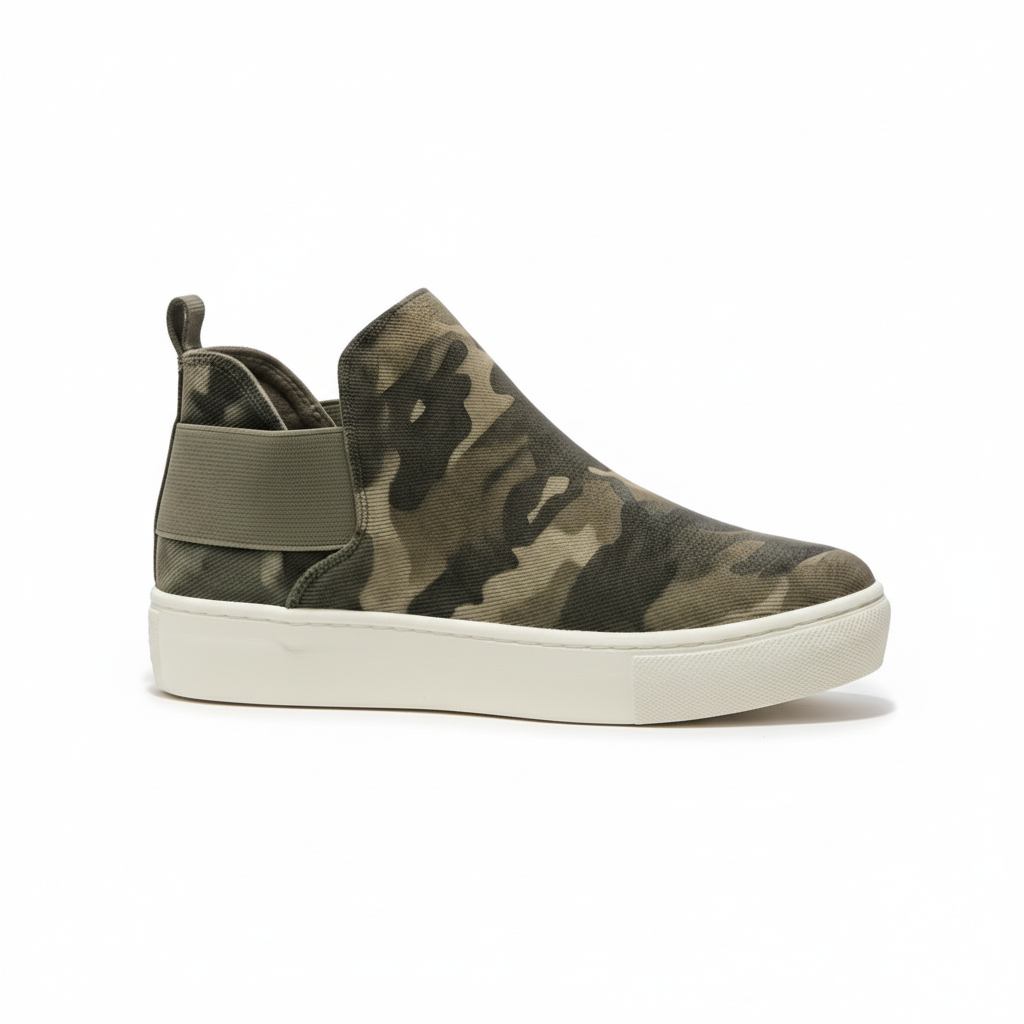 Camouflage slip-on sneaker with a white sole on a white background