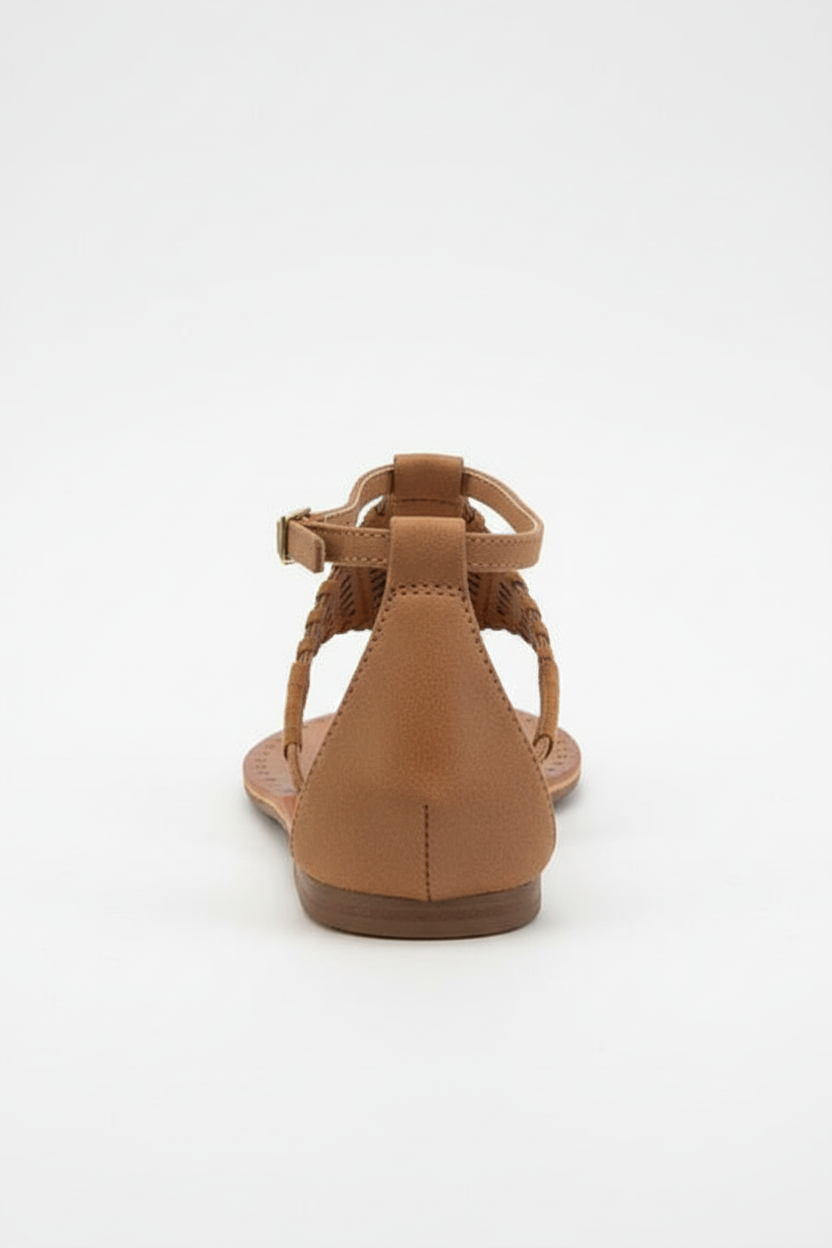 Brown sandal with a single strap on a white background