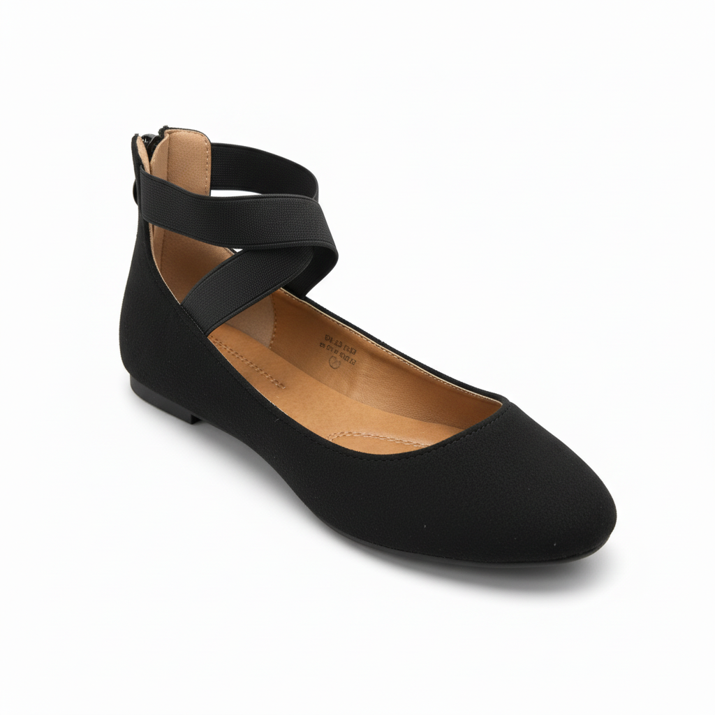 Black flat shoe with a strap on a white background