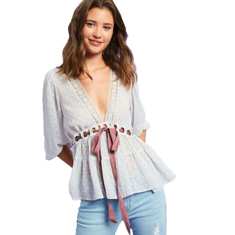 Ladies, look no further than this Boho Grey Swiss Dot Belted Plunging V-Neck Ruffle Blouse! Flirty, semi-sheer textured chiffon meets an adjustable contrast bow waist tie, a plunge V-neck, and lace on the neck.