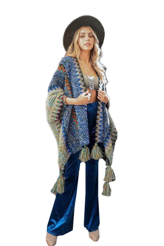 This 100% Acrylic Ruana adds a rainbow of crochet chic to your wardrobe! Wearing just one size fits most, it's a 42" x 30" statement piece that will brighten any ensemble.