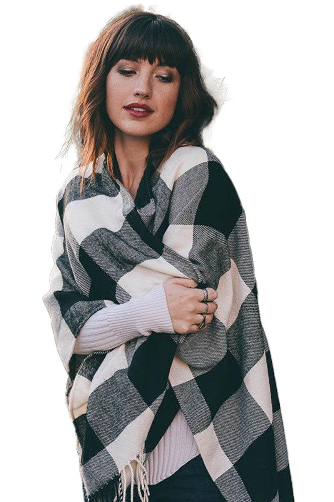 Check out the Women's Buffalo Check Tassel Poncho! You'll be the talk of the town with this 46"x55" masterpiece crafted from 100% acrylic. Perfectly poised between cozy and chic, this fashion statement will ensure you never have another underdressed moment! 