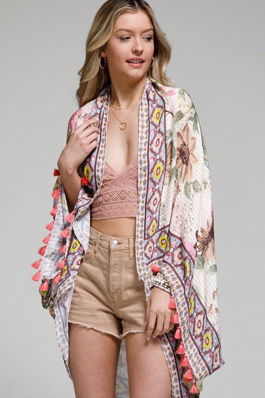 A Moroccon floral-festooned bordered cocoon kimono APPROX. L 19.50" W 49.5 is sure to turn heads and spark conversations - the perfect way to make an eye-catching entrance!